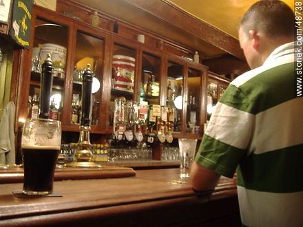 Regular customer and his beer - Ireland - BRITISH ISLANDS. Photo #48738