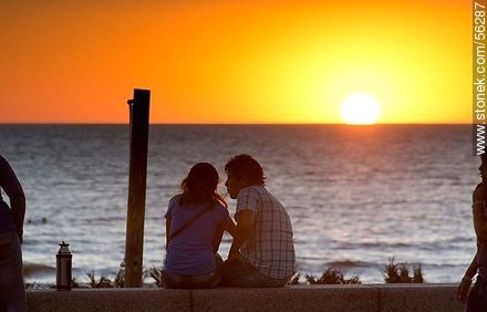 Couple drinking mate at sunset - Department of Montevideo - URUGUAY. Photo #56287