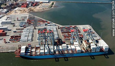 Aerial view of cranes at Terminal Cuenca del Plata in operation unloading containers from a freighter Maersk Line - Department of Montevideo - URUGUAY. Photo #58244