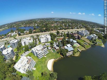 Aerial view of houses on the Avenue of the Americas and lakes - Department of Canelones - URUGUAY. Photo #61808