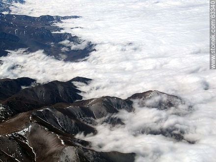 The Andes Mountains with snowy peaks in a sea of ​​clouds - Chile - Others in SOUTH AMERICA. Photo #63340