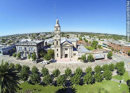 Aerial photo of the church Nuestra Señora del Pilar in front of Constitution Square on the steet 25 de Mayo - Rio Negro - URUGUAY. Photo #63744