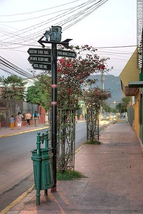 Post with arrows and distances to cities. Concepción Street - Chile - Others in SOUTH AMERICA. Photo #63991