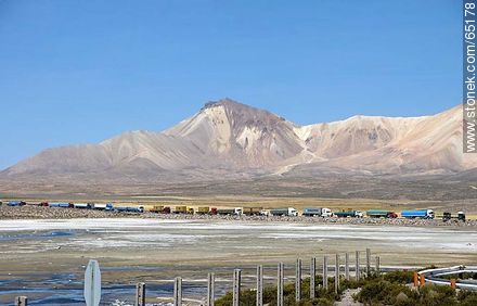 Chungará Lake. Nevados de Quimsachata. Time line of trucks waiting at the border post - Chile - Others in SOUTH AMERICA. Photo #65178