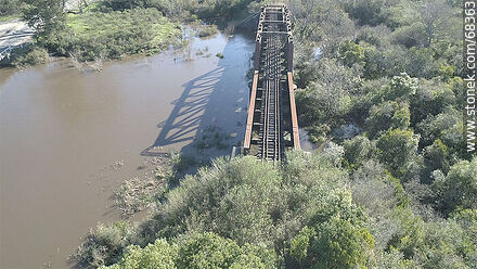 Aerial view of the railroad bridge over La Virgen Creek, departmental boundary between San Jose and Florida -  - MORE IMAGES. Photo #68363