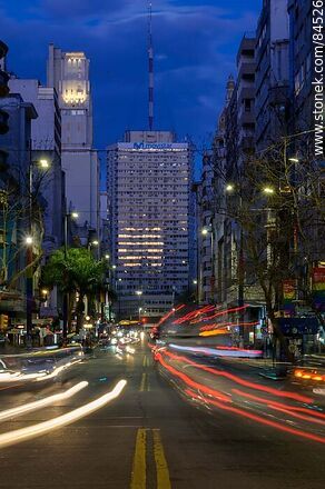 18 de Julio Avenue. Gaucho Tower. Trail of lights left by the traffic at dusk. - Department of Montevideo - URUGUAY. Photo #84526
