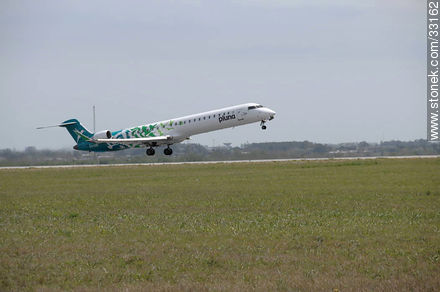 Pluna's Bombardier plane taking off -  - MORE IMAGES. Photo #33162