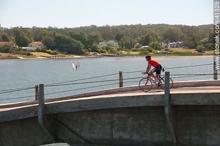 Cyclist on the bridge over Maldonado creek - Punta del Este and its near resorts - URUGUAY. Photo #41329