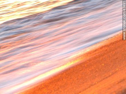 Breaking waves on the shore at sunset -  - MORE IMAGES. Photo #47491