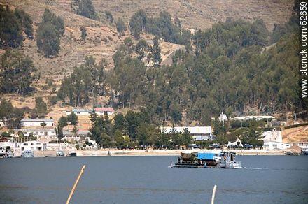 Tiquina Straits on Lake Titicaca. Flat-bottomed  boats crossing two trucks to the other side - Bolivia - Others in SOUTH AMERICA. Photo #52659