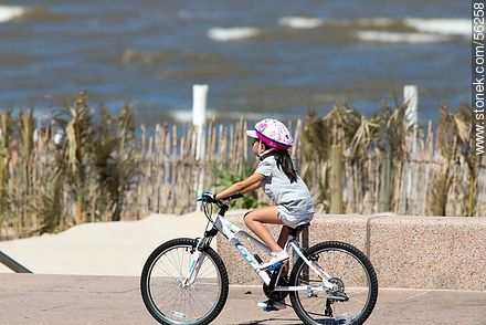 Girl cyclist with helmet - Department of Montevideo - URUGUAY. Photo #56258