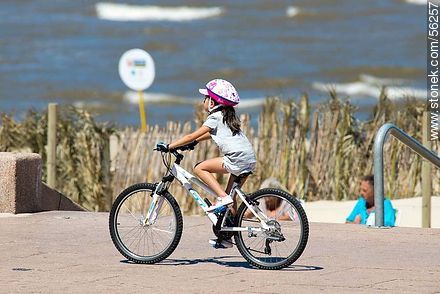 Girl cyclist with helmet - Department of Montevideo - URUGUAY. Photo #56257