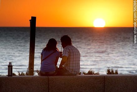 Couple drinking mate at sunset - Department of Montevideo - URUGUAY. Photo #56286