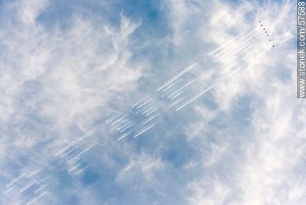 Aerobatics flight formation of the Brazilian Fumaça Escuadrilha Squadron airplanes writing in the sky with smoke - Department of Montevideo - URUGUAY. Photo #57588