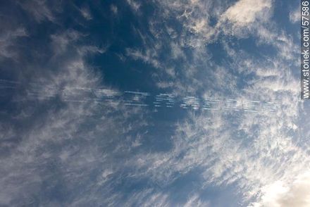 Aerobatics flight formation of the Brazilian Fumaça Escuadrilha Squadron airplanes writing in the sky with smoke - Department of Montevideo - URUGUAY. Photo #57586