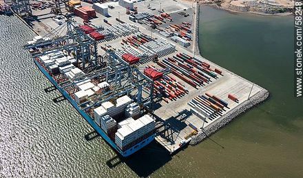 Aerial view of cranes at Terminal Cuenca del Plata in operation unloading containers from a freighter Maersk Line - Department of Montevideo - URUGUAY. Photo #58248