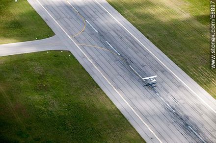 Aerial view of a small plane taking off Carrasco Airport - Department of Canelones - URUGUAY. Photo #58897