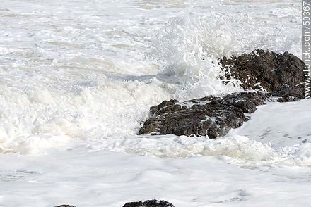 Foam on the sea and rocks -  - MORE IMAGES. Photo #59367