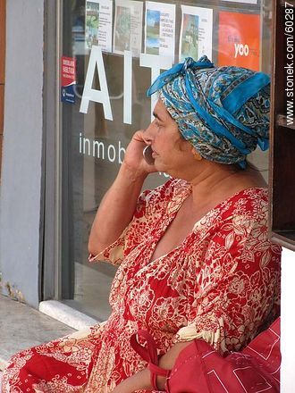 Gypsy talking by phone - Punta del Este and its near resorts - URUGUAY. Photo #60287