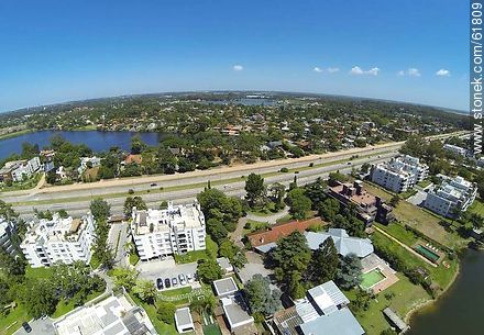 Aerial view of houses on the Avenue of the Americas and lakes - Department of Canelones - URUGUAY. Photo #61809