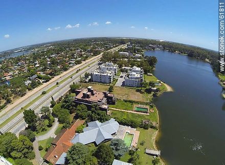 Aerial view of houses on the Avenue of the Americas and lakes - Department of Canelones - URUGUAY. Foto No. 61811