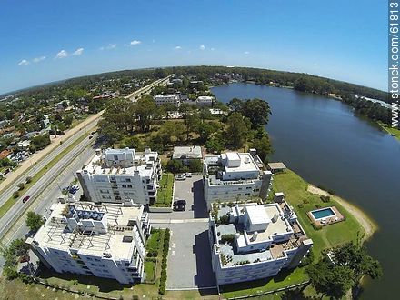 Aerial view of houses on the Avenue of the Americas and lakes - Department of Canelones - URUGUAY. Photo #61813