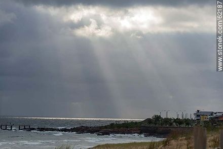 Rays of sun peeking through clouds - Department of Maldonado - URUGUAY. Photo #62187