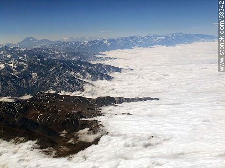 The Andes Mountains with snowy peaks in a sea of ​​clouds - Chile - Others in SOUTH AMERICA. Photo #63342