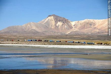 Chungará Lake. Nevados de Quimsachata. Time line of trucks waiting at the border post. Cerro Umurata - Chile - Others in SOUTH AMERICA. Photo #65176