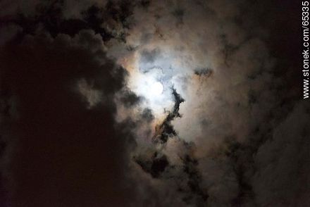 Moon behind cloudy sky -  - MORE IMAGES. Photo #65335