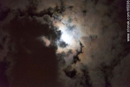 Moon behind cloudy sky -  - MORE IMAGES. Photo #65336