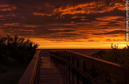 Access to the beach. Reddish clouds at sunset - Department of Maldonado - URUGUAY. Foto No. 65736