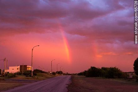 Reddish clouds at sunset, rainbow - Department of Maldonado - URUGUAY. Photo #65728