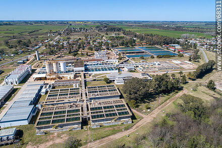 Aerial view of the town and OSE's water treatment plant - Department of Canelones - URUGUAY. Photo #68311