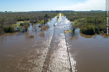 Aerial view of the Santa Lucia River overflowing covering the old Route 11 - Department of Canelones - URUGUAY. Photo #68325