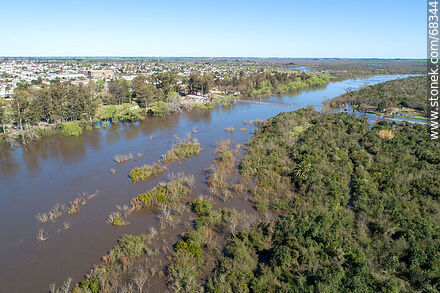 Aerial view of the Santa Lucia River overflowing covering the old Route 11 - Department of Canelones - URUGUAY. Photo #68344