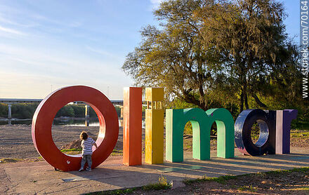 Olimar's lettering poster in front of the river of the same name - Department of Treinta y Tres - URUGUAY. Photo #70164