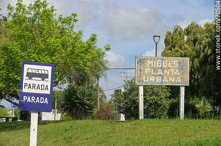 Migues sign, urban plant and bus stop - Department of Canelones - URUGUAY. Photo #70504
