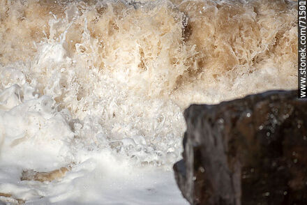 The sea breaking in a big wave over the rocks. - Department of Maldonado - URUGUAY. Photo #71262