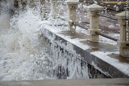 Foam breaking over the sea wall and splashing the promenade - Department of Maldonado - URUGUAY. Photo #71655