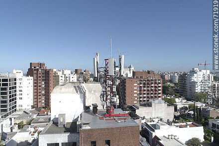 Cell phone antennas on top of a building -  - MORE IMAGES. Photo #71919