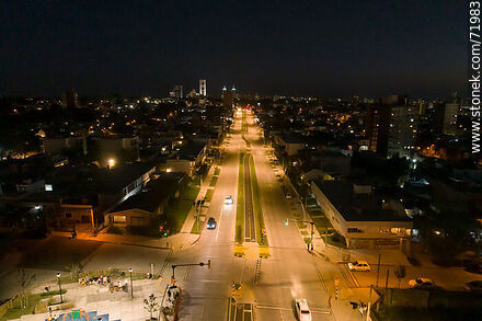 Aerial night view of the Miguel Hernandez plaza over L. A. de Herrera Ave. - Department of Montevideo - URUGUAY. Photo #71983
