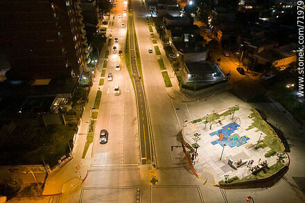 Aerial night view of the Miguel Hernandez plaza over L. A. de Herrera Ave. - Department of Montevideo - URUGUAY. Photo #71979