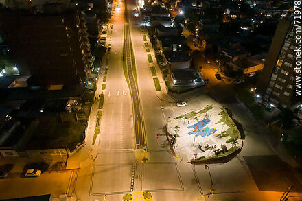 Aerial night view of the Miguel Hernandez plaza over L. A. de Herrera Ave. - Department of Montevideo - URUGUAY. Photo #71978