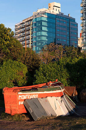 Artisanal fishermen's boat in front of buildings on the promenade - Department of Montevideo - URUGUAY. Photo #72785