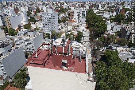 Aerial view of cellular telephone antennas on the rooftop of a building - Department of Montevideo - URUGUAY. Photo #73117