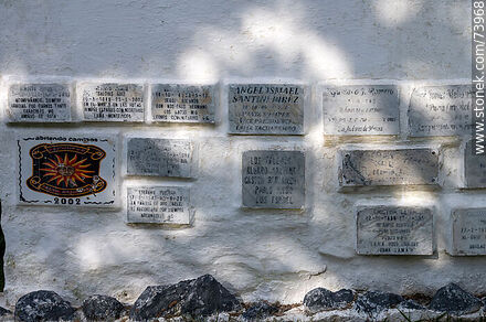 Funeral plaques on a wall in the shape of a bird. Pachucos, Banda Oriental - Tacuarembo - URUGUAY. Photo #73968