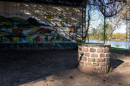 Cistern and mural in front of the river - Department of Cerro Largo - URUGUAY. Photo #74333
