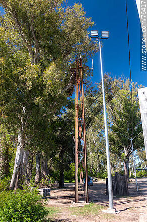 Old electrical distribution column and modern lighting column - Durazno - URUGUAY. Photo #76417