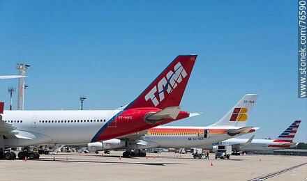 TAM, Iberia and American Airlines aircraft at the terminal - Department of Canelones - URUGUAY. Photo #76590